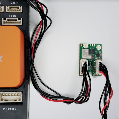 Photo of Dronetag DRI connected to flight controller unit