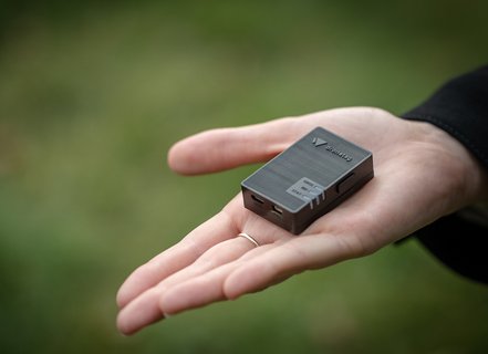Dronetag Mini held in a hand